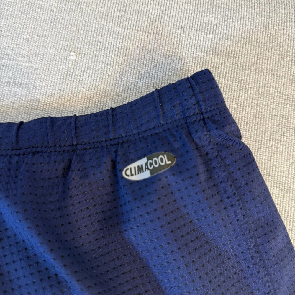Adidas women's athletic climacool shorts size S. Navy blue with‎ purple stripes